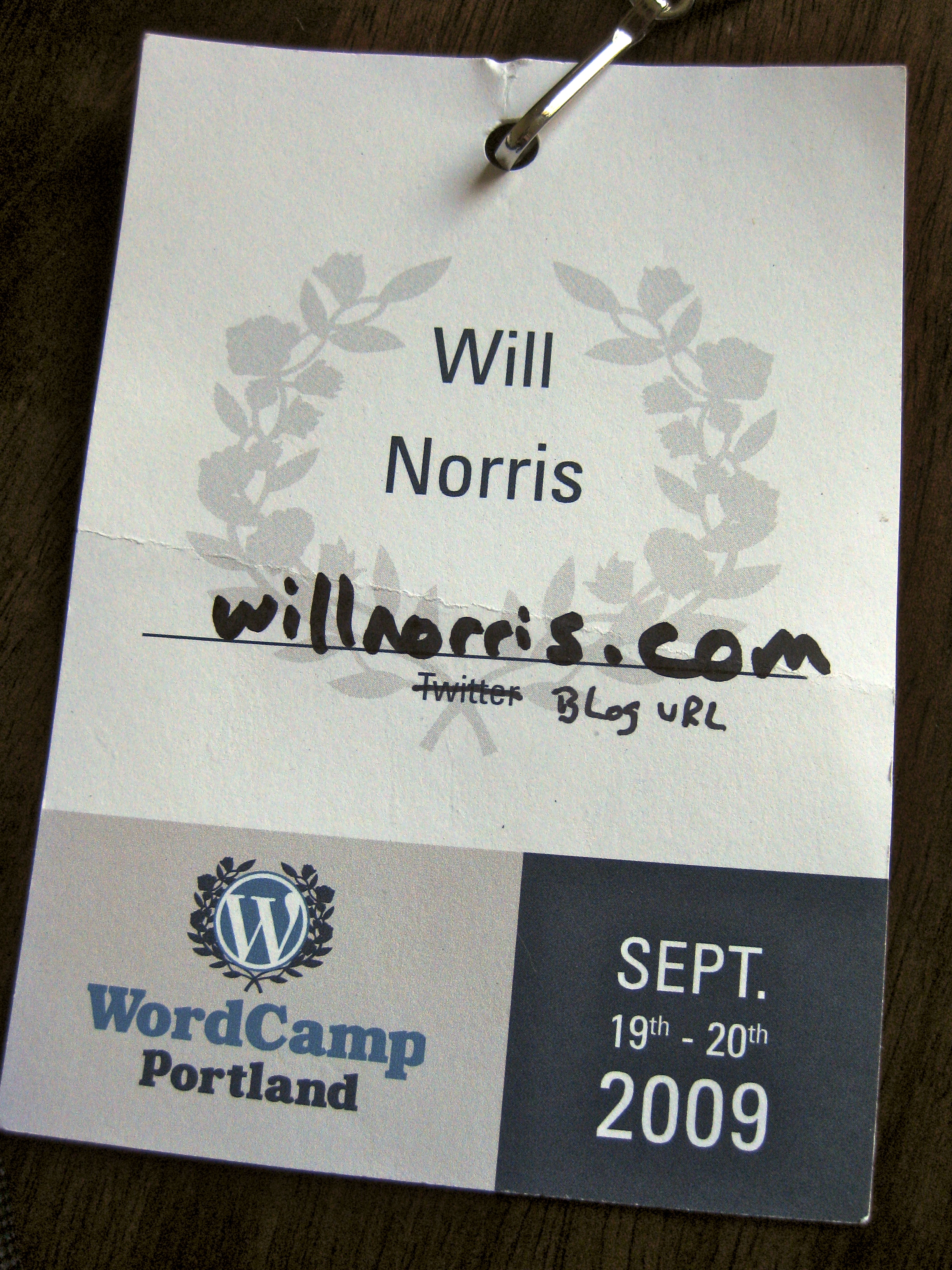 WordCamp Portland name badge with 'Twitter' label crossed out and replaced
  by handwritten label 'Blog URL'