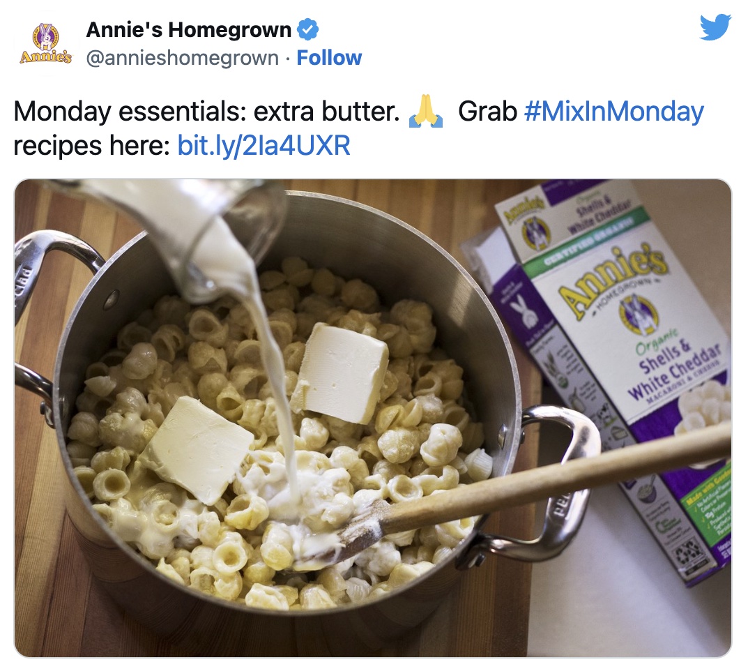 Tweet from Annie's showing milk and butter being added into a pot of cooked pasta